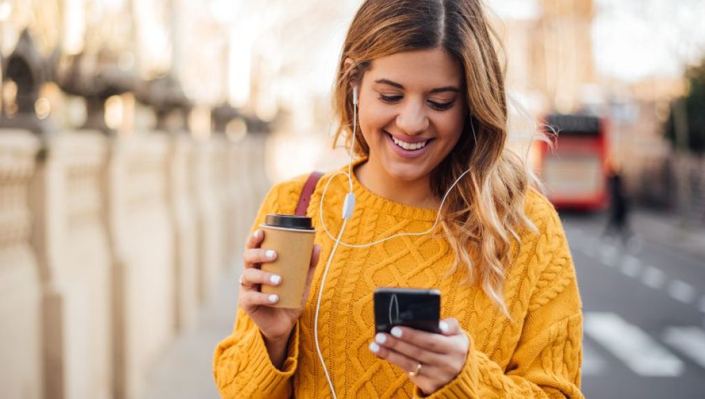 woman using three mobile phone 